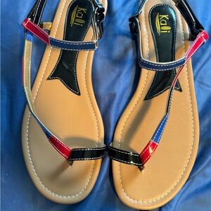 Slide into these cute easy velcro strap flat sandals..